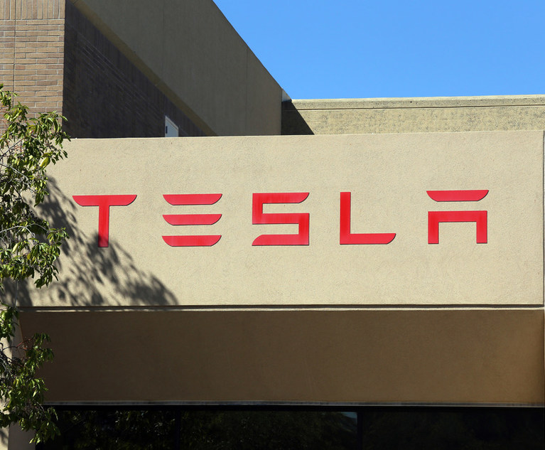 Tesla Says Legal Chief David Searle Hasn't Left the Building