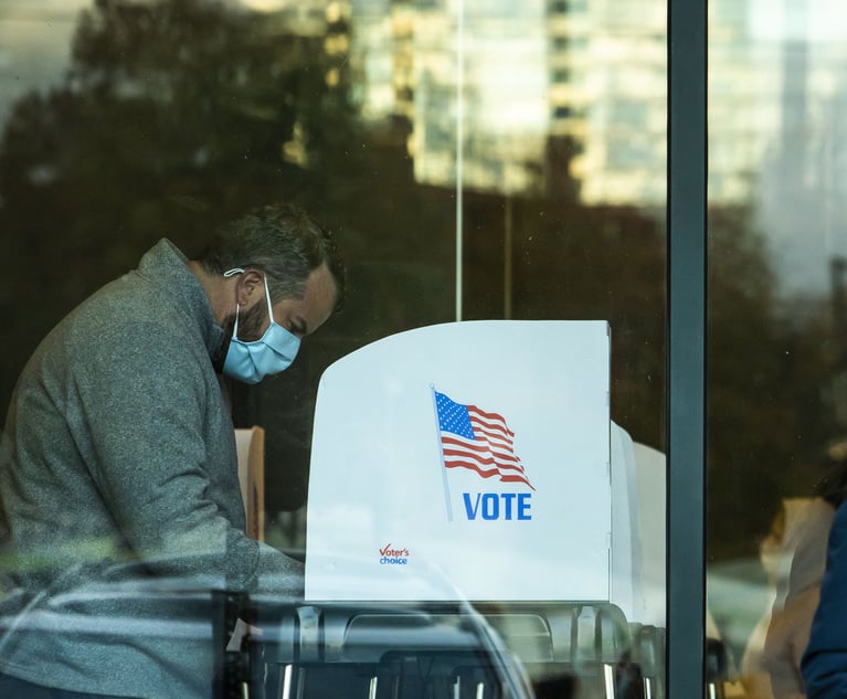 People cast their ballot during early voting in the 2020 Presidential Election, on Friday, October 30, 2020. Photo: Diego M. Radzinschi/ALM