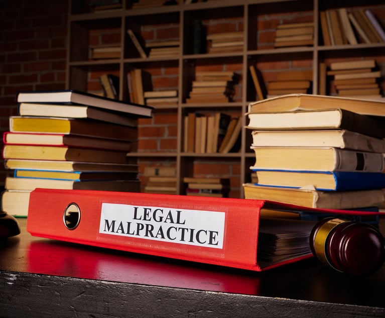 Documents about legal malpractice in the red folder.