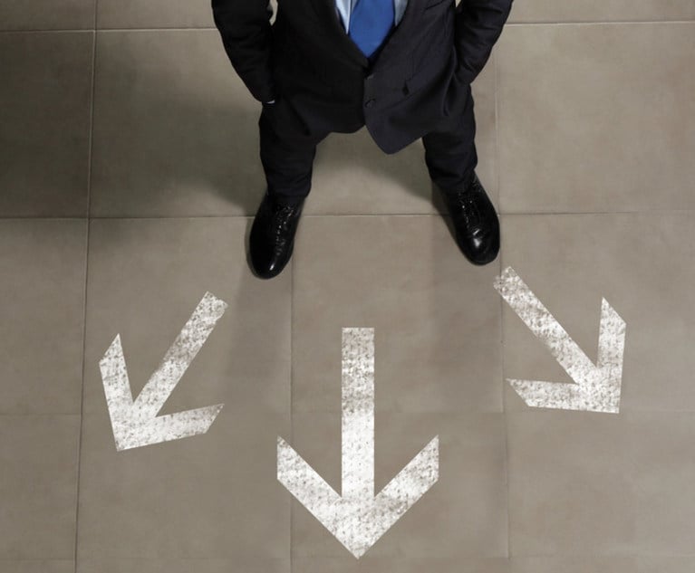 man standing in front of three arrows pointing in different directions