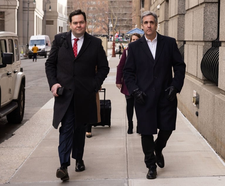 Michael Cohen, right, former personal lawyer to President Donald Trump, exits federal court in Manhattan on Thursday, Dec. 14, accompanied by Jon-Michael Doughert, Of Counsel at Gilbert LLP. Photo: Yuki Iwamura/Bloomberg