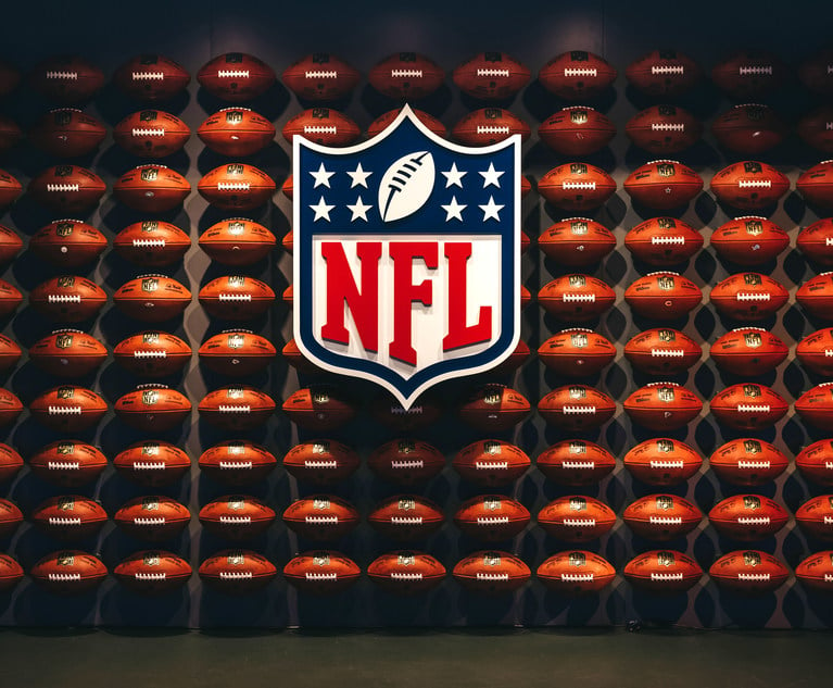 Rows of american football balls in NFL Experience in Times Square, New York.