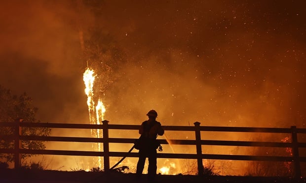 Los Angeles-area fire explodes in size, forces thousands to evacuate