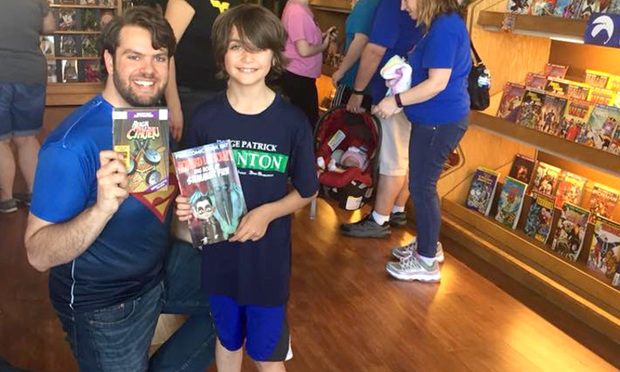 Carmelo Chimera, left, with a customer at his comic book store, Chimera's Comics. 