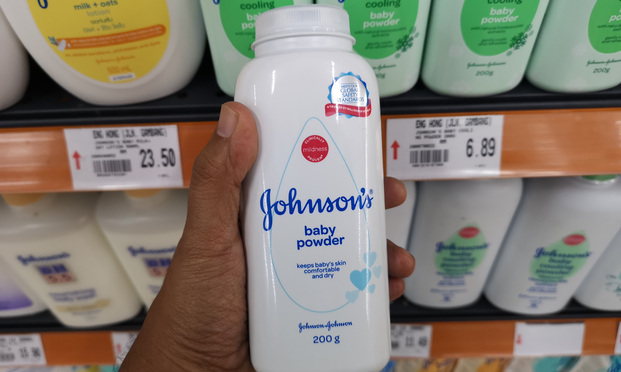 Johnson's baby powder packages on the supermarket shelf..