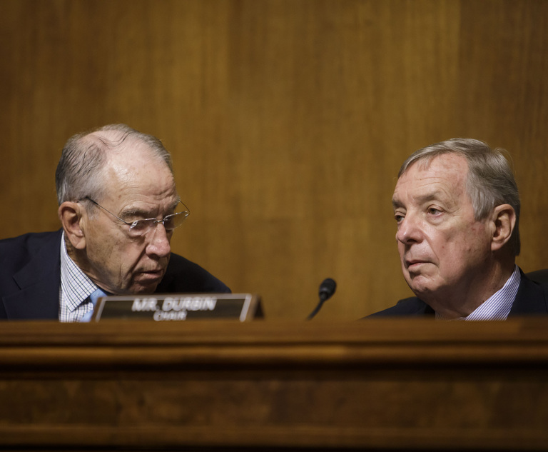 Senator Richard Durbin (D-IL), Chairman of the Senate Judiciary Committee, right, speaks with Ranking Member Senator Charles Grassley (R-IA), left, during a judicial nominations hearing, on October 6, 2021.