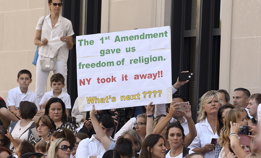 A rally outside the Albany County Courthouse on Aug. 14, during hearing challenging the constitutionality of the state legislature's repeal of the religious exemption to vaccination.