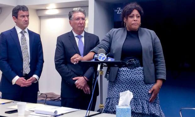 At a news conference on Oct. 3, attorneys Dominique Penson of Barasch McGarry Salzman & Penson and Ira Zalkin of Zalkin Law Firm listen as Amala Muhammed Redd, who is suing the Brooklyn Friends School after allegedly being abused and raped by a janitor at the school in the early 1980s as a third grader, explains how the newly enacted New York Child Victims Act has changed her life. (Photo by Jason Grant)