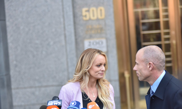 Stormy Daniels and lawyer Michael Avenatti leave the Daniel P. Moynihan Courthouse in Manhattan after a hearing in front of Judge Kimba Wood regarding a search warrant that was executed at the home, hotel and office of Trump's lawyer Michael Cohen. ..(Photo by David Handschuh/NYLJ)..