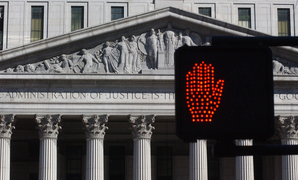 New York Courthouse and don't walk sign. Photo: Rick Kopstein