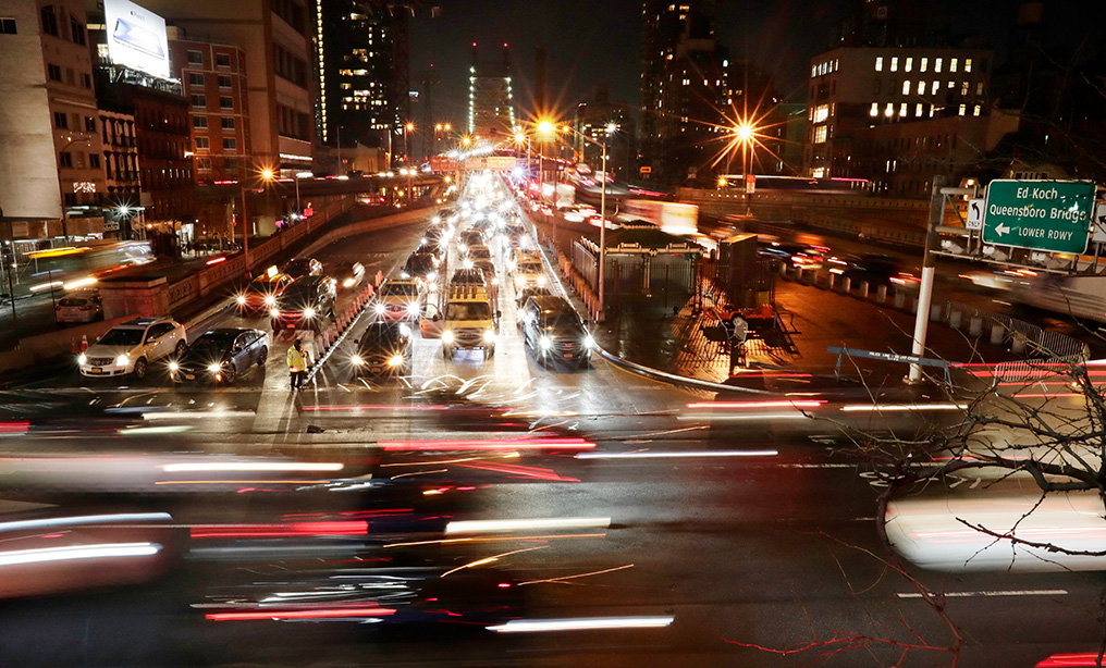Vehicles pass the Queensboro Bridge in New York. New York state would become the 13th state to permit driver's licenses for immigrants who entered the country illegally under legislation passed the state Assembly early this year. Photo: Frank Franklin II/AP