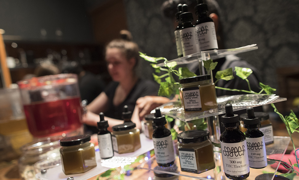 Samples of THC laced products are on display as a bartender prepares drinks at the Spleef NYC canna-cocktail party in New York early this year, while the discussion on legalization of recreational marijuana continues. Photo: Mary Altaffer/AP