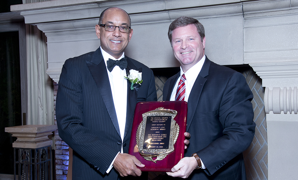 Nassau County Administrative Judge Norman St. George, left, was honored with the Norman F. Lent Memorial Award presented by the Criminal Courts Bar Association of Nassau County at the association’s annual dinner on Jan. 23 at the Fox Hollow in Woodbury, N.Y. The annual award, recognizing the highest standards of the legal profession, was presented to St. George for his extraordinary and efficient leadership of the Nassau County courts. As administrative judge, St. George oversees the operations of all the Nassau County courts, with direct supervision of nearly 90 judges and over 900 non-judicial employees. The award was presented by F. Scott Carrigan, right, president of the Criminal Courts Bar Association of Nassau County. Photo: Hector Herrera/NCBA