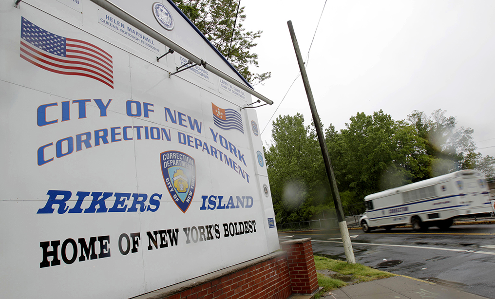 Sign near the gate at the Rikers Island jail complex. Mayor Bill de Blasio on Thursday announced that 40 inmates would be let out of the city’s jails. Photo: Seth Wenig/AP