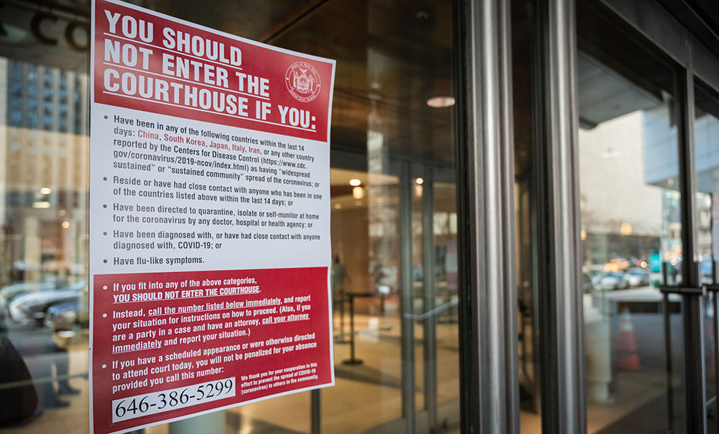 Sign outside of the New York City courthouses warning against people with coronavirus symptoms to enter the courts, Tuesday, March 17, 2020. Photo: Ryland West/ALM