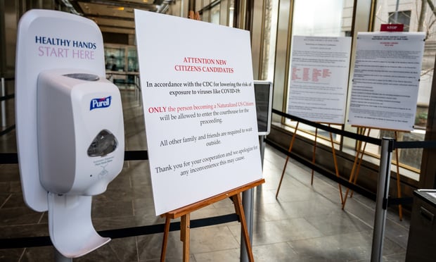 Purell container and sign announcing courts partial closure due to coronavirus at Manhattan state courthouse, Tuesday, March 17, 2020. Photo: Ryland West/ALM