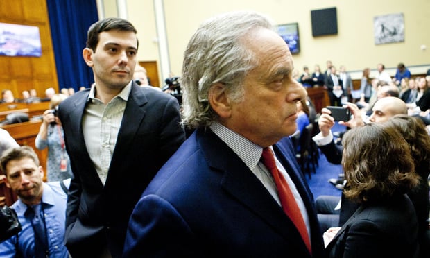 Martin Shkreli (left), former Chief Executive Officer of Turing Pharmaceuticals, leaving the hearing room after appearing before the House Committee on Oversight and Government Reform during a hearing titled "Developments in the Prescription Drug Market," on February 4, 2016. Mr. Shkreli, on the advice of his attorney, Ben Brafman, right, of Brafman & Associates, refused to answer any questions. Photo by Diego M. Radzinschi/THE NATIONAL LAW JOURNAL.