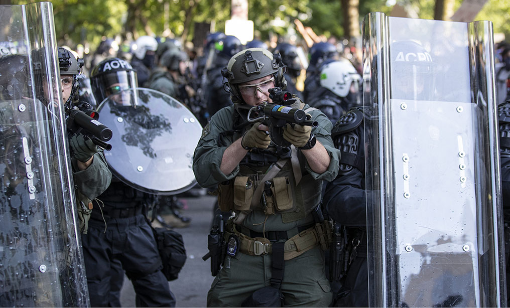 Arlington County Police officers confront demonstrators near the White House on June 1. Photo: Alex Brandon/AP