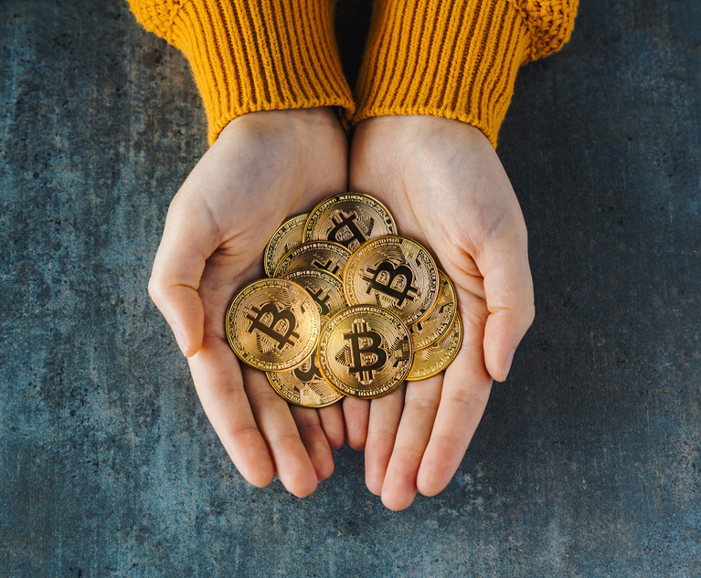 Overhead view of two hands full of bitcoins on a textured background. Golden coins BTC, Stock Market of cryptocurrencies concept and digital decentralized finances concept