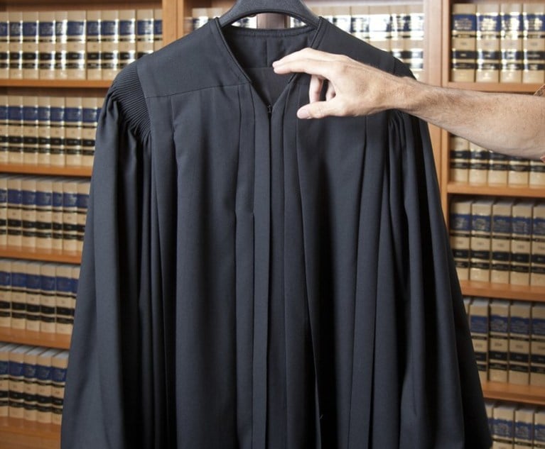 Hand and judicial robe photo illustration..Photo by Jason Doiy and S. Todd Rogers.8-29-13.062-2013.