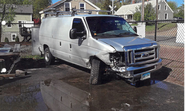 Christian Fongemie's Ford E350 van after it was struck by another vehicle
