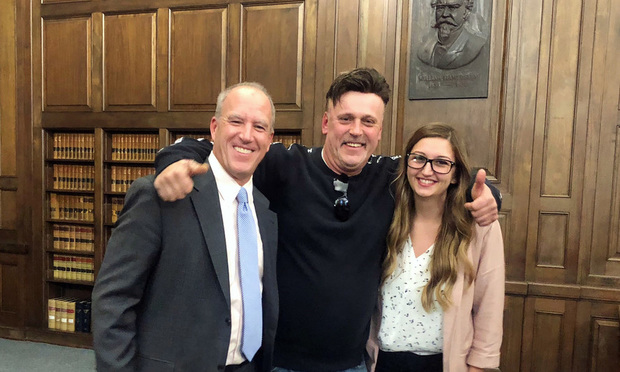 Richard Vichas (center) is shown in court after hearing he just won a $1.85M jury verdict in a case related to his exposure to lead paint. Far left is attorney John Mills and far right is attorney Megan Boorsma, both with Mills Law Firm.