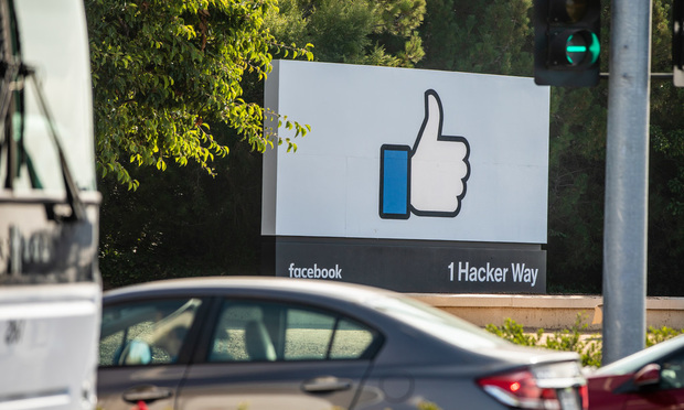 A giant thumbs-up button marks the entrance to the Facebook campus, located in Menlo Park, CA.