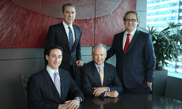 From left, sitting, Stuart J. Weissman and Stuart N. Ratzan, of Ratzan Law Group in Miami. Standing, from left, John Crabtree of Crabtree & Auslander in Key Biscayne, and Edward Zebersky of Zebersky Payne in Fort Lauderdale.