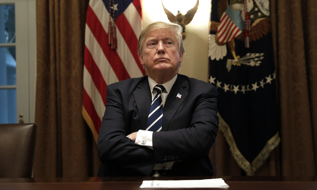 U.S. President Donald Trump listens during a meeting with members of Congress in the Cabinet Room of the White House. 