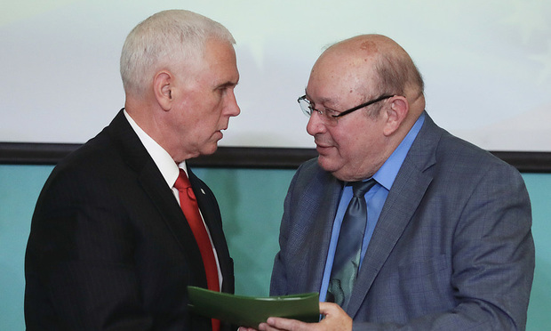 Vice President Mike Pence, left, shakes Pedro Mena's hand at Iglesia Doral Jesus Worship Center during a roundtable discussion on the political crisis in Venezuela on Friday, Feb. 1, 2019, in Doral. (AP Photo/Brynn Anderson)
