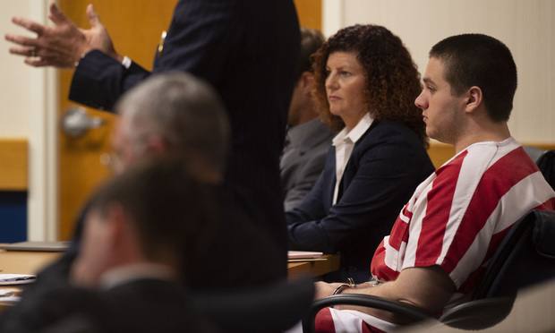 Austin Harrouff, right, who is accused of killing a Tequesta couple in 2016, listens as his attorney Robert Watson addresses Martin County Circuit Judge Sherwood Bauer, Jr. (not pictured) during a hearing Thursday, June 13, 2019, at the Martin County Courthouse in Stuart, Fla. (Leah Voss/TCPalm.com via AP)