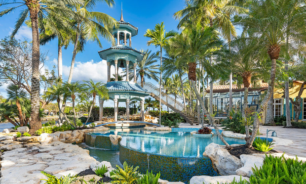 The amenities at the late H. Wayne Huizenga's Fort Lauderdale estate include a resort-style pool with a three-story gazebo that has a curved staircase. Courtesy photo.