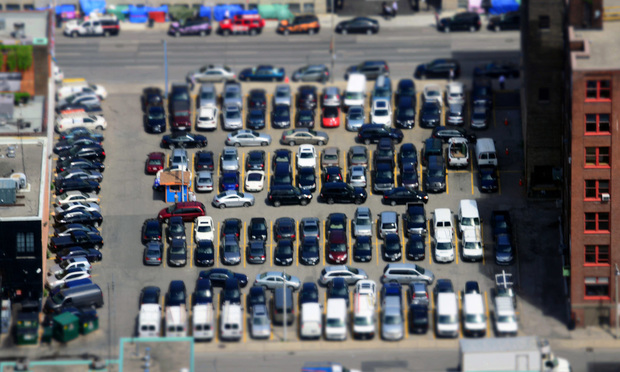 Crowded parking lot/photo by Nic Redhead, via Flickr