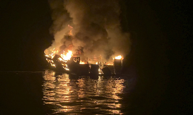 A dive boat is engulfed in flames after a deadly fire broke out aboard the commercial scuba diving vessel off the Southern California Coast. (Santa Barbara County Fire Department via AP, File)
