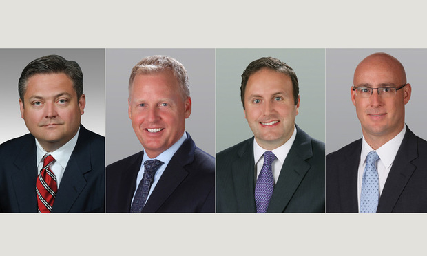 From left, Cushman & Wakefield vice chairman Robert Given, executive managing director Troy Ballard, executive managing director Zachary Sackley and director Neal Victor.
