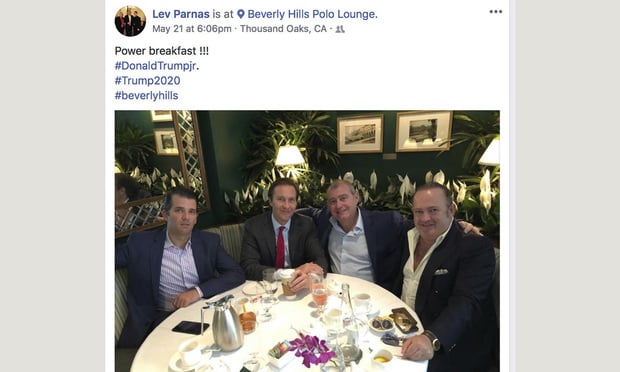 This Facebook screen shot provided by The Campaign Legal Center shows, from left, Donald Trump Jr., Tommy Hicks Jr., Lev Parnas and Igor Fruman, posted on May 21, 2018. Parnas and Fruman were arrested on Thursday, Oct. 10, 2019, on campaign finance violations resulting from a donation to a political action committee supporting President Donald Trump's reelection. (The Campaign Legal Center via AP)