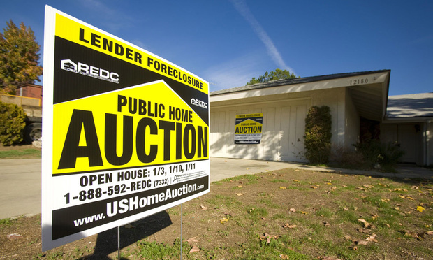 A foreclosure sign in front of a home. Photo: Bloomberg News.