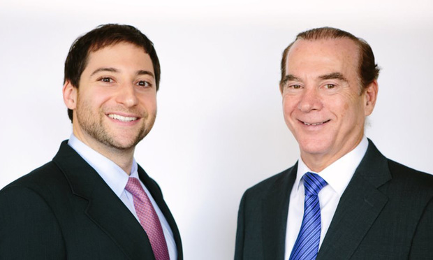 Charles Penan, left, executive vice president and Howard Taft, right, senior managing director with Aztec Group.