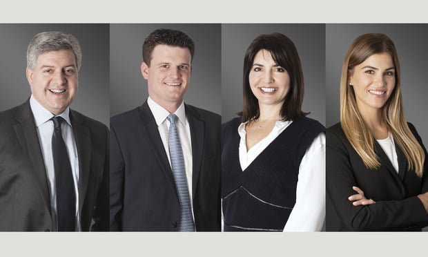 Greenberg Traurig Miami real estate practice group chair and condo team leader Gary Saul with shareholders Andre Sharpe and Meredith Singer as well as associate Trisha Ojea Villegas, all based in Miami.