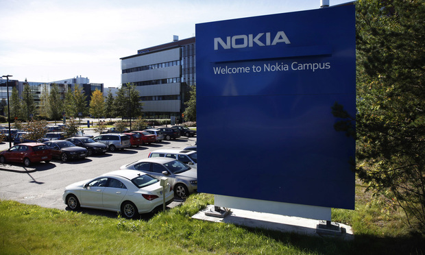 A sign stands outside Nokia's headquarters in Espoo, Finland, on Tuesday, Sept. 13, 2016.