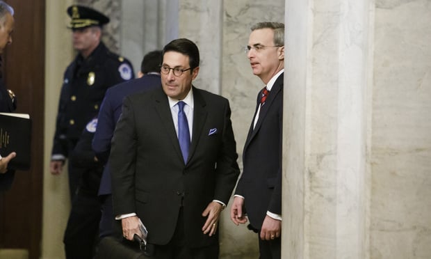 President Trump’s personal attorney Jay Sekulow, left, and White House counsel Pat Cipollone, right, arrive with their legal team at the U.S. Capitol in Washington for the second day of the Senate Impeachment trial against President Donald Trump, on Wednesday, January 22, 2020.