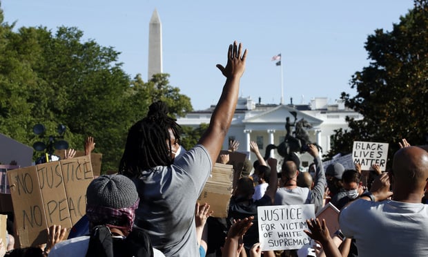 Demonstrators gather in Lafayette Park in Washington, D.C., on Monday to protest the death of George Floyd. (AP Photo/Alex Brandon)