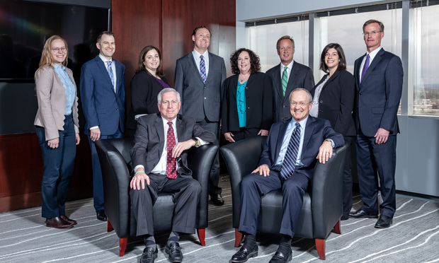 Standing, left to right: Nicole Nielson-Pachkofsky, associate, Robert Gilmartin Jr., partner, Kelly Belnick, associate, Tim Freeman, associate, Lori Chapin, associate, Chris Keale, partner, Marina McGuire, partner, Thomas Robertson, partner. Seated: Michael Tanenbaum, firm chair, James Keale, firm president.