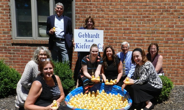 GEBHARDT FIRM ENTERS RUBBER DUCKY RACE: Gebhardt & Kiefer staff get ready for the Clinton Sunrise Rotary’s Great Rubber Ducky Race on July 14 by sponsoring 135 rubber ducks. Staff members pictured include Donna Dias (front), (left to right) Patti Hammer, Richard Cushing, Lisa Arrigo, Tara St. Angelo, Diana Fredericks, Mark Chazin, Kelly Lichtenstein, and Gail Gitch.