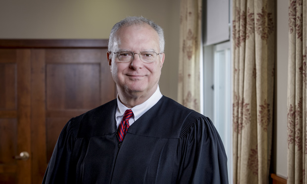 U.S. Federal Magistrate Judge Joseph Dickson.