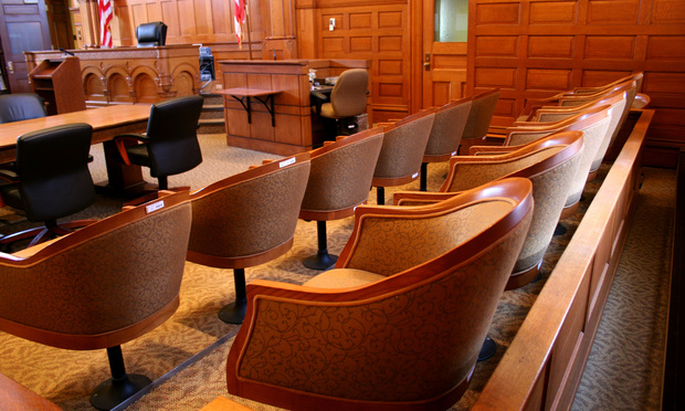 empty jury box in a courtroom