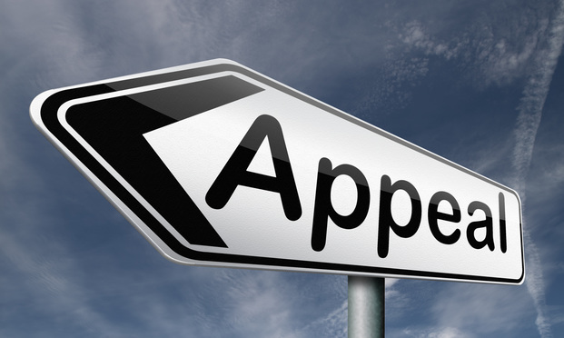 A street sign with the word "appeal" against a blue sky.