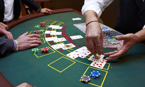 Casino dealer dealing cards