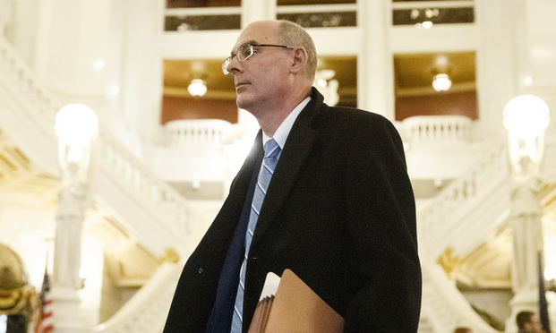 Former state prosecutor Frank Fina walks in the Pennsylvania Capitol after oral argument before the Pennsylvania Supreme Court, in Harrisburg, Pa., Wednesday, Nov. 20, 2019. Fina faces possible law license suspension over his handling of a grand jury witness during the investigation into Penn State's response to complaints about Jerry Sandusky. (AP Photo/Matt Rourke)
