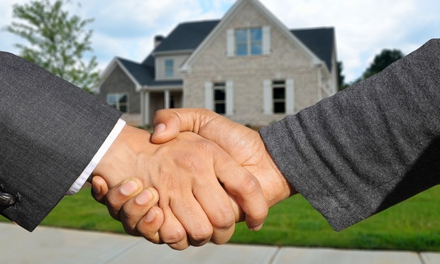 Real Estate deal handshake graphic
